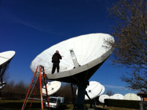 Technician Cleaning Satellite